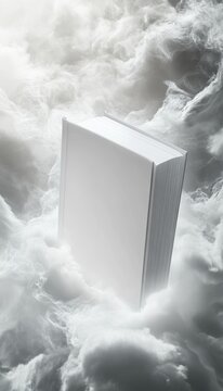 A blank book gracefully drifting among shimmering silver clouds and glowing misty light