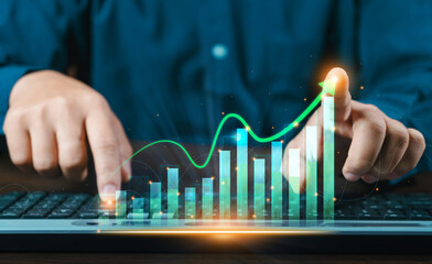 A businessman investor analyzes the profitability of working companies with digital augmented...