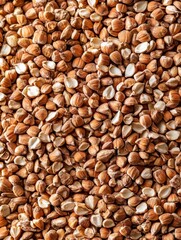 A variety of crushed nuts in a small cup.