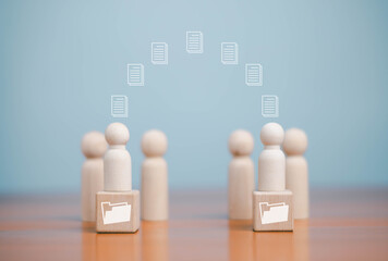 wooden block to upload documents from folders to manage online document databases and organize file space on a software system. To disseminate information in various agency offices