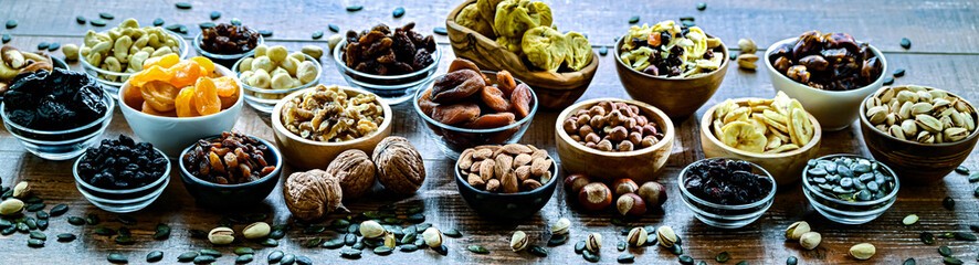 Composition with a variety of dried fruits and assorted nuts.