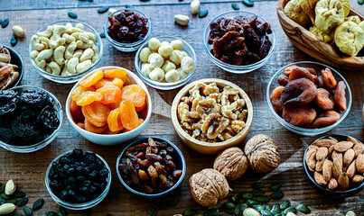 Composition with a variety of dried fruits and assorted nuts.