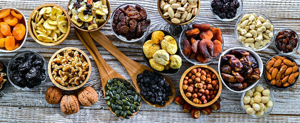 Composition with a variety of dried fruits and assorted nuts.