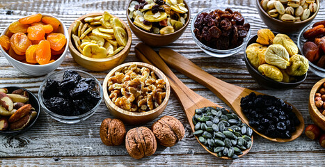 Composition with a variety of dried fruits and assorted nuts.
