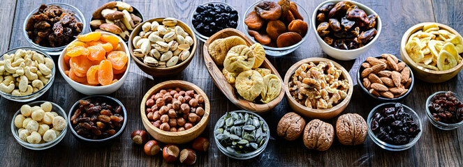 Composition with a variety of dried fruits and assorted nuts.