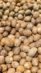 Nutmeg on the counter in the supermarket. Prepared for sale. Healthy food