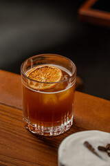 Amber Cocktail Icy Delight with Dehydrated Orange Garnish