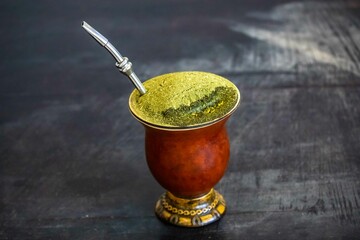 Traditional chimarrão served in a gourd and with araucaria pine nuts