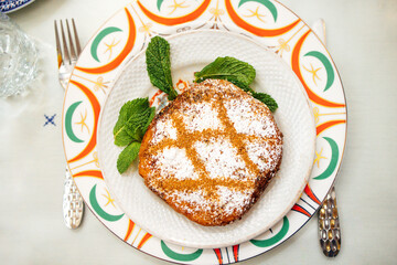 Freshly baked delicious chicken Moroccan pastilla (pastela) on vintage patterned dish. Traditional food, recipes, pastries, culinary culture concepts. Horizontal close up