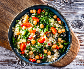 A plate of couscous served with vegetables and chickpeas