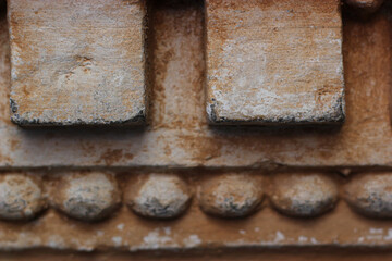 Geometric stucco mouldings on the wall, antique plastering. Old elements of wall design. Vintage stucco mouldings. 