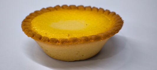 Egg tarts that are crispy on the outside and soft on the inside. Egg tarts that have a rich and creamy egg aroma. Egg tarts on white background.