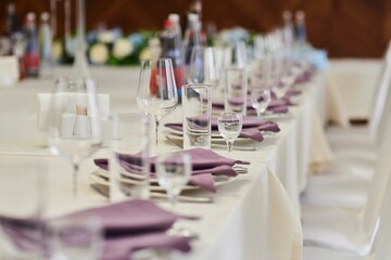 Table setting, ready for the reception of guests. Glasses for drinks on the table