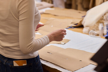 Tailoring Craftsmanship A Fashion Designer at Work Creating Beautiful Patterns with Precision