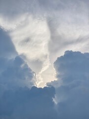 A stunning cloud in the brightly blue sky.