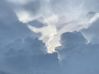 A stunning cloud in the brightly blue sky.