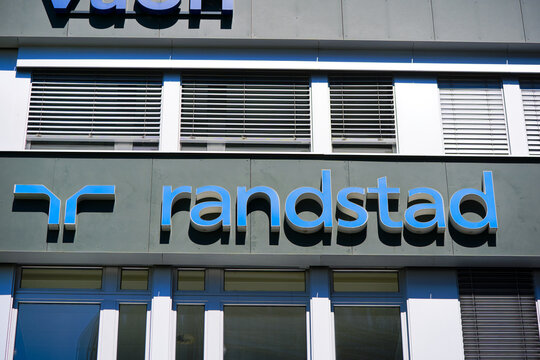 Blue logo of randstad company at facade of office building at Swiss City of Z&uuml;rich on a sunny spring day. Photo taken April 30rd, 2025, Zurich, Switzerland.