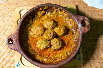 Flavorful kefta tagine cooked in rich tomato sauce, lamb meatballs, traditional moroccan delight