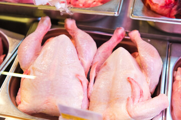 Fresh chicken on the counter in the supermarket