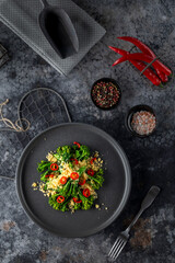 Delicious gourmet dish of roasted broccoli and couscous seasoned with chili pepper