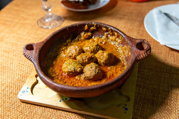 Flavorful kefta tagine cooked in rich tomato sauce, lamb meatballs, traditional moroccan delight