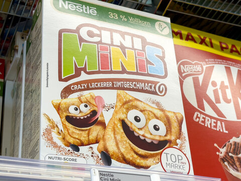 Nestl&eacute; cini minis cereal box with cartoon cinnamon squares on store shelf