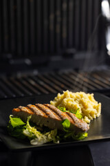 tuna fish steak with couscous and salad