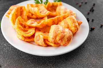 Chips bacon crispy rashers corn snacks fast food natural food fresh dish on the table rustic food top view copy space