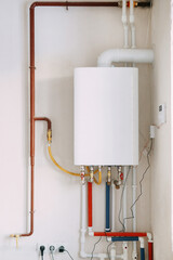 Installation of a gas boiler with colored pipes equipped with valves and connectors for efficient...