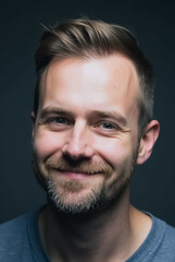 Obraz premium Portrait of a Confident Man: A close-up, studio shot of a man with a captivating smile and warm expression, radiating approachability and intelligence. 