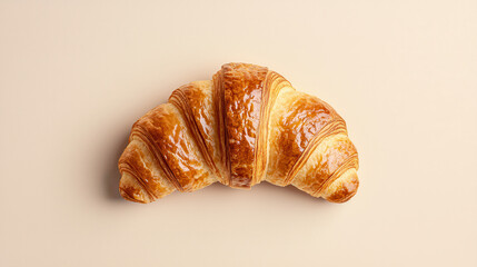 Fresh gourmet croissant with golden layers and glossy finish, perfect for breakfast
