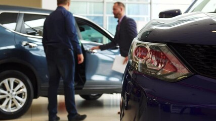 Excited buyer prepares for a thrilling test drive of a sleek new car