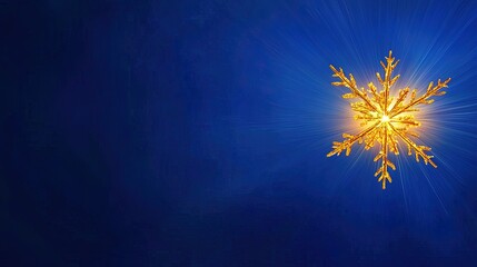 A radiant golden snowflake design against a deep blue backdrop.