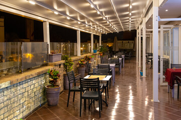 Terrace of a Moroccan restaurant in a modern style at night