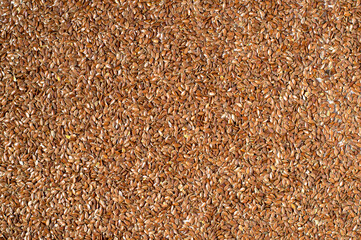 Flaxseed all over background. Horizontal, top view. Healthy food, diet, omega3