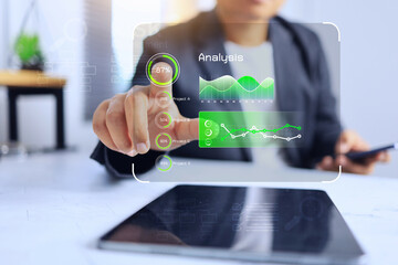 Businessman pointing on data analysis to get the business information to use in business planning