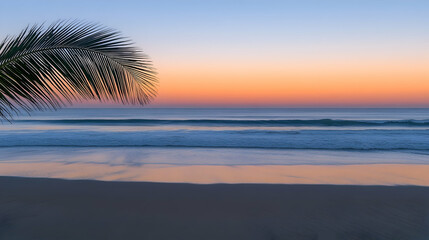 Calm ocean view during scenic sunset with palm frond, tropical paradise