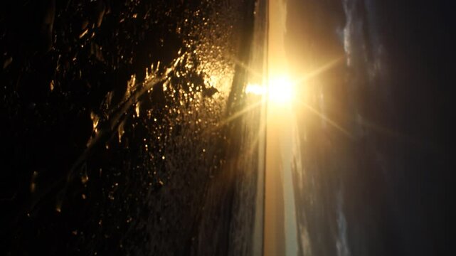 Sunset along wild coast of Sea of Japan. Sakhalin. A beach, ocean meadow, and lots of caddis fly. Far East, here begins night and day of extended Siberia. Sea is like maternity hospital for cyclones