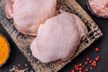 Chicken thigh raw, fresh poultry meat with salt and spices