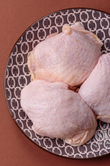 Chicken thigh raw, fresh poultry meat with salt and spices