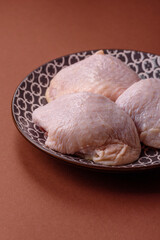 Chicken thigh raw, fresh poultry meat with salt and spices