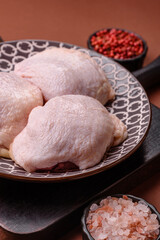 Chicken thigh raw, fresh poultry meat with salt and spices