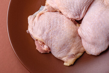 Chicken thigh raw, fresh poultry meat with salt and spices