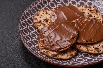 Matzah with chocolate paste for the Jewish holiday of passover