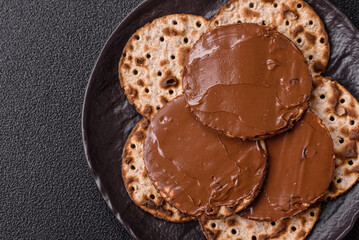 Matzah with chocolate paste for the Jewish holiday of passover