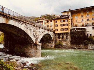View of the Ponte Antonini over a tributary of the river Sesia in Varallo, an Italian Alpine town in valley Valsesia, Varallo (VC), Central Alps, Italy