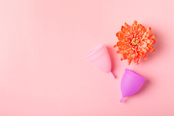 Menstrual cup on a bright background. Sanitary napkins, tampons and menstrual cup.Concept of...