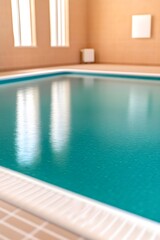 Obraz premium Calm teal indoor pool with bright window reflections