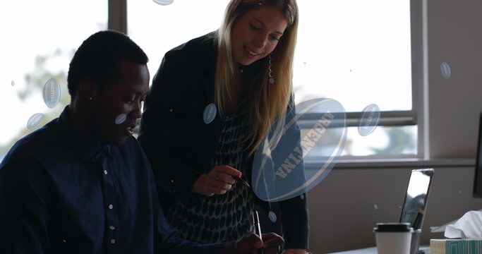 Image of rugby balls with argentina text over diverse business people talking