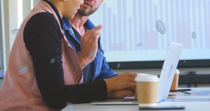 Image of rugby balls with argentina text over caucasian business people talking